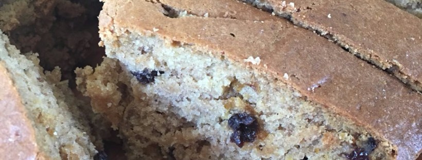 A slice of pumpkin and current quick bread