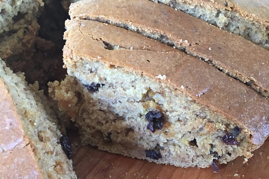 A slice of pumpkin and current quick bread