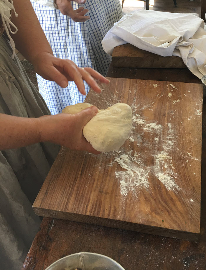 Slap dough hard on the board