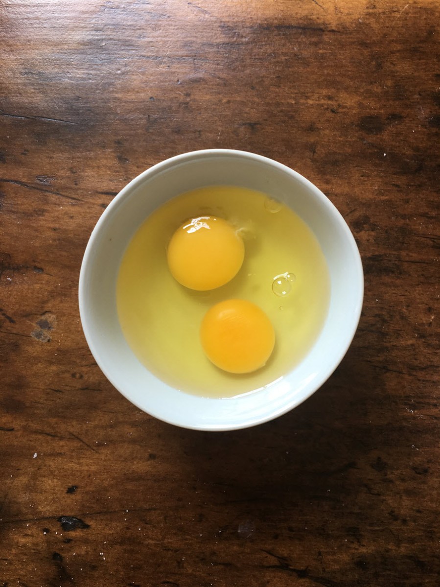 Place two eggs in dish