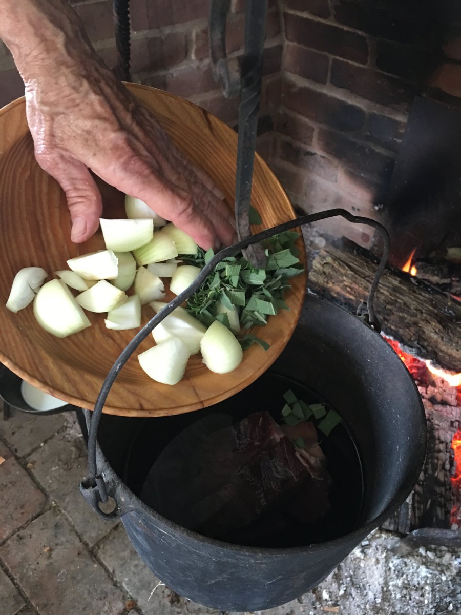Add onions and herbs to kettle